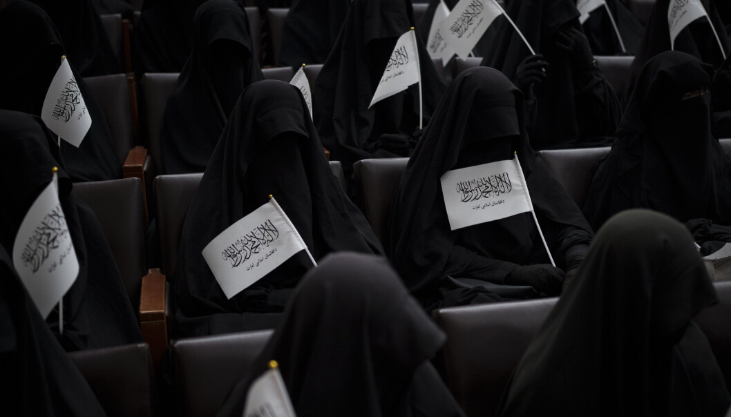 Women wave Taliban flags as they sit inside an auditorium at Kabul University's education center during a demonstration in support of the Taliban government in Kabul, Afghanistan, Saturday, Sept. 11, 2021. (AP Photo/Felipe Dana) Women wave Taliban flags as they sit inside an auditorium at Kabul University's education center during a demonstration in support of the Taliban government in Kabul, Afghanistan, Saturday, Sept. 11, 2021. (AP Photo/Felipe Dana)