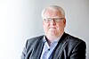 Terje André Olsen i Blindeforbundet, med briller og grå dressjakke.